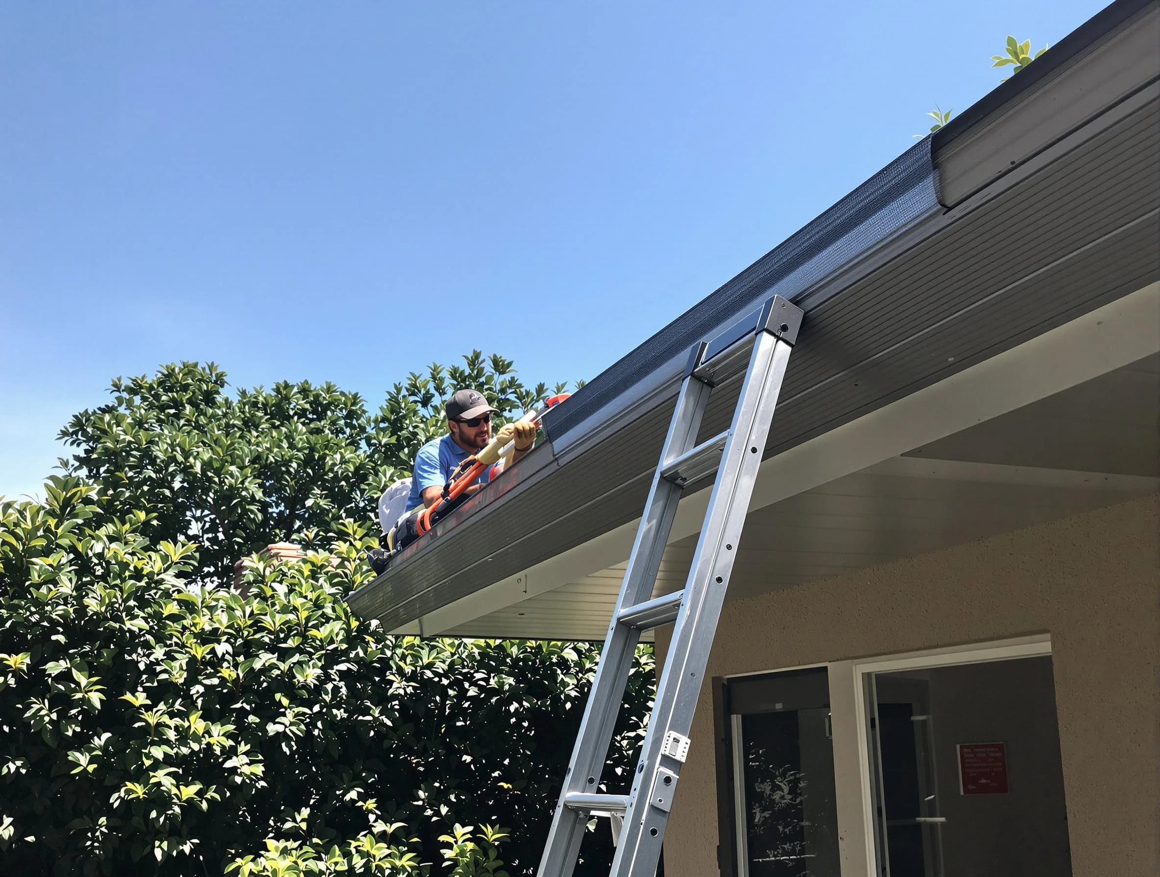 Parma Heights Roofing Company installing gutter guards for a homeowner in Parma Heights, OH